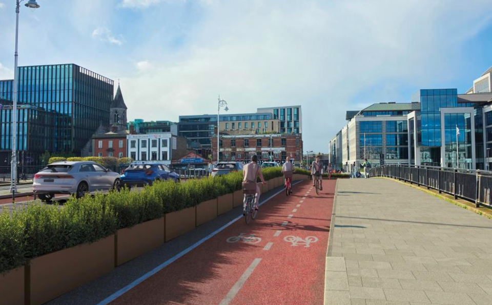 A photomontage of a bike lane and car traffic lanes crossing a bridge in an urban setting